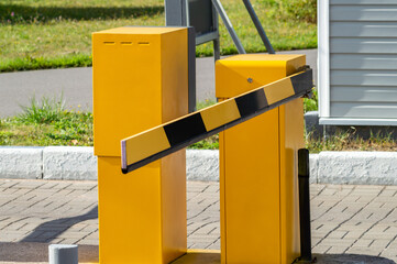 Closed barrier at paid parking. Selective focus