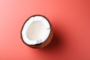 Coconut on light beige background top view