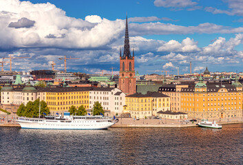 View of the city courthouse and the bell tower of Riddarholmen Church in Stockholm.