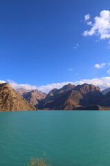 Turquoise mountain lake Iskandarkul located in Fann mountains, Sughd, Tajikistan