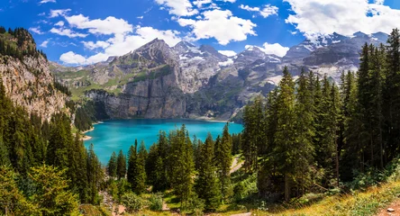 Foto op Canvas Idyllic swiss mountain lake Oeschinensee (Oeschinen) with turquise water and snowy peaks of Alps mountains near Kandersteg village aerial high angle view. Switzerland nature scenery © Freesurf