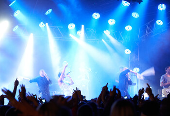 Concert crowd, music festival lights or band audience listen rock, metal or celebrity star, artist...
