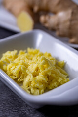 Grated ginger roots placed on a ceramic container