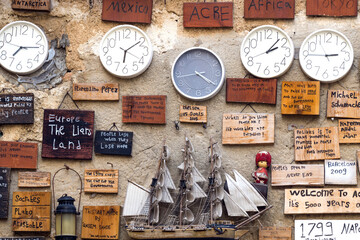 Many clocks hang on the wall, and reviews from tourists