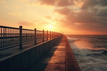 Fototapeta na wymiar A beautiful sunset over the ocean, casting a warm glow on a pier. Perfect for adding a serene and calming touch to any project.