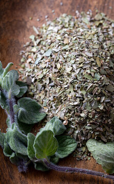 Chopped dried oregano and fresh oregano leaves