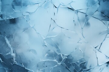 Shattered ice texture in cool blue tones, perfect for abstract backgrounds and winter themes.