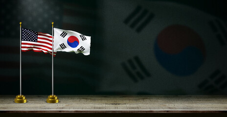 south korea and USA flag wave on dark background. digital illustration for national activity or...