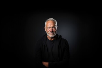 Smiling Man In Black Studio, Showcasing Sweater Artistic Portrait