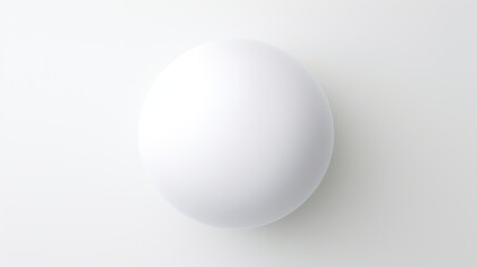  a white egg sitting on top of a white table next to a black and white clock on a white wall.