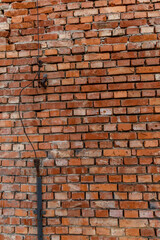 Old red brick wall damaged lightning rod collapsing brick wall