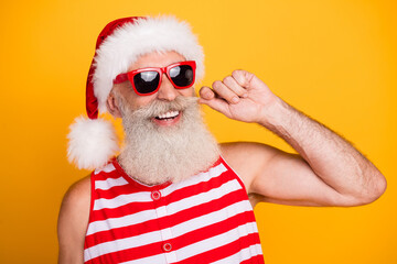 Photo of excited cool senior guy dressed christmas swimwear hat glasses visiting barbershop...