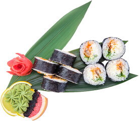 Portion of smoked eel rolls with cucumber on bamboo leaf