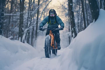 Foto op Canvas a man rider riding a fat bike bicycle in snow covered road trail in cold frosty winters © DailyLifeImages