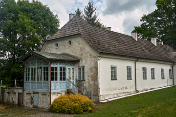 Fototapeta na wymiar entrance with stone columns to a historic manor house in the city Zloty Potok