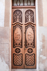 Carved wooden door in the old town of Caceres