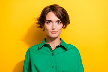 Portrait of attractive experienced business confident person professional wearing green formal shirt isolated yellow color background