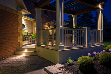 Beautiful custom built deck and pergola at night.