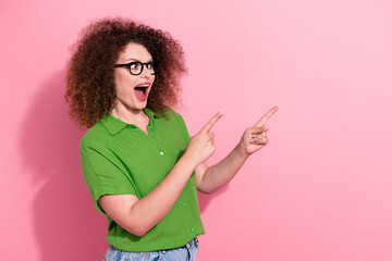 Photo portrait of pretty young girl excited point look empty space dressed stylish green outfit...