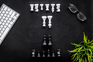 Business strategy concept. Chess pieces on office table, top view