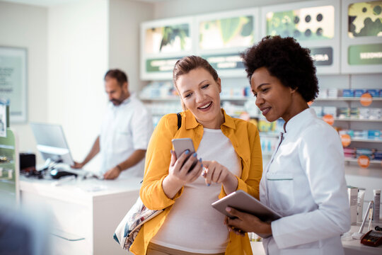 Pharmacist Consulting with a Customer in a Pharmacy
