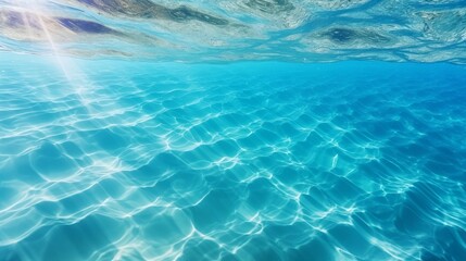 The serene and vibrant turquoise-colored deep ocean water with gentle ripples glistening under the bright sunshine on a typical summer day in a tropical country.