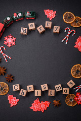 Beautiful Christmas composition with copy space with an inscription in wooden cubes