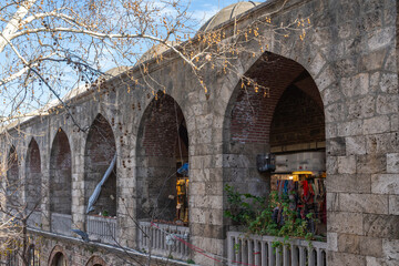 Fototapeta na wymiar Bursa Koza Han the shopping center of ancient times today's fabric market