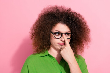Photo portrait of pretty young girl fix specs minded think hmm wear trendy green outfit isolated on pink color background