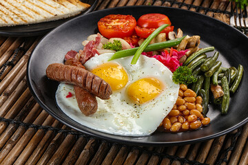 Traditional Engrlish breakfast with egg  and sausages