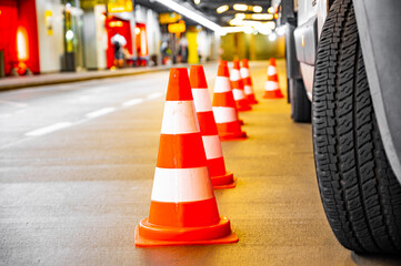 road cones around car. technician or maintenance car.