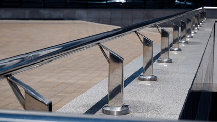 stainless steel restrictive railings, outside.