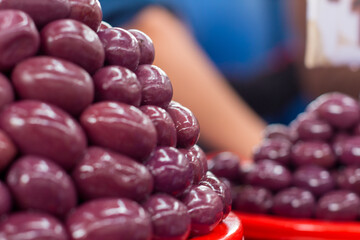 Macro photography of black olives in the covered central market of Arequipa, Peru.