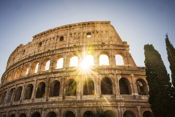 Colosseum with sunburst.