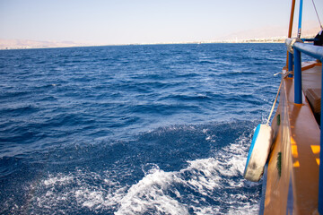 Ship side floating on water and moving forward