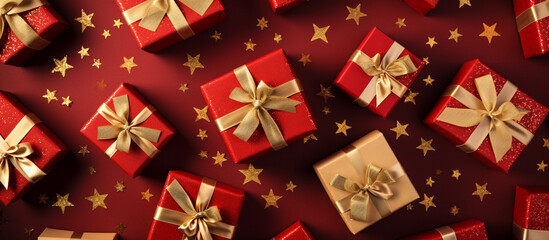 Symmetrical layout of wrapped gifts in red and gold, with a central Christmas star decoration, Christmas background, top view, with copy space