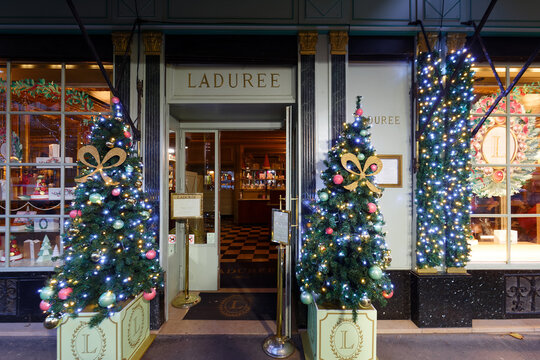 The famous Laduree bakery and tea room located in Paris near Madeleine church . Laduree was founded in 1862 and is a luxury brand known for its macaroon.
