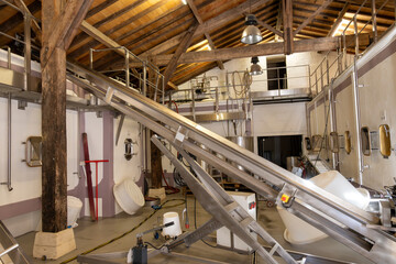 Concrete tanks for first fermentation of grapes, Bordeaux Saint-Emilion wine making region, harvest...