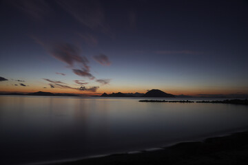 Fototapeta premium sunset on the beach. Seaside town of Turgutreis and spectacular sunsets. Selective Focus. Long Exposure shoot. tranquility scene.
