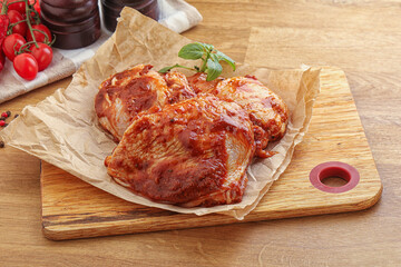 Marinated chicken leg in tomato sauce
