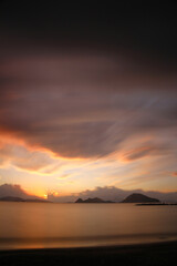 Fototapeta premium sunset on the beach. Seaside town of Turgutreis and spectacular sunsets. Selective Focus. Long Exposure shoot. tranquility scene.