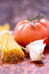 Isolated garlic and tomato spaghetti