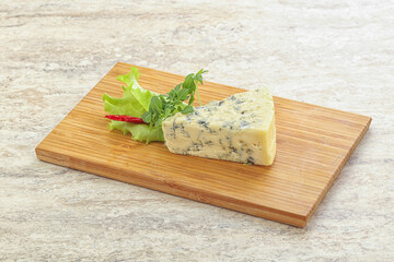 Blue cheese piece over board