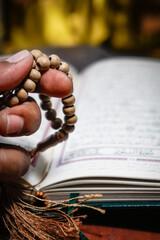 Dzikir , praying by count the prayer beads.
