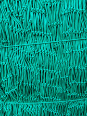 New strong green fishing net.  Abstract green fishing net background perfect for designs creation or web banners conception..