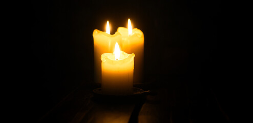 Infinite Warmth: Three Candles in the Midnight Abyss