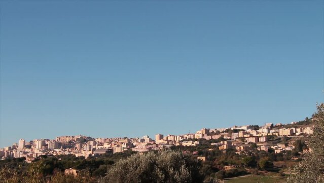 agrigento sicily italy buildings homes houses on hill wide shot pan left to right panorama