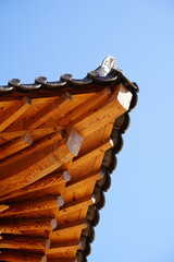 Fototapeta premium a beautiful traditional Korean eaves. Heaven and traditional eaves. delicate woodwork. Hanok.