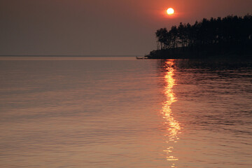 Streak of heavenly fire accross water