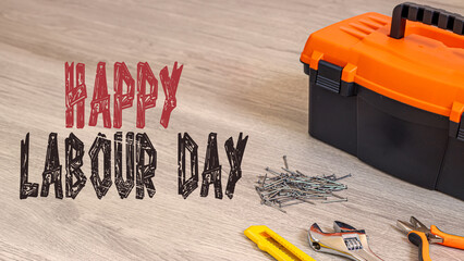 Happy Labour Day text in the image. Construction and production tools with a background celebrating...